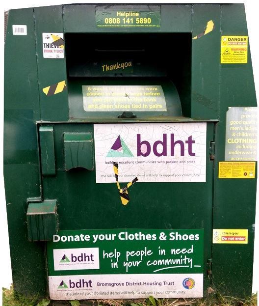 image of a green metal clothing donation bank