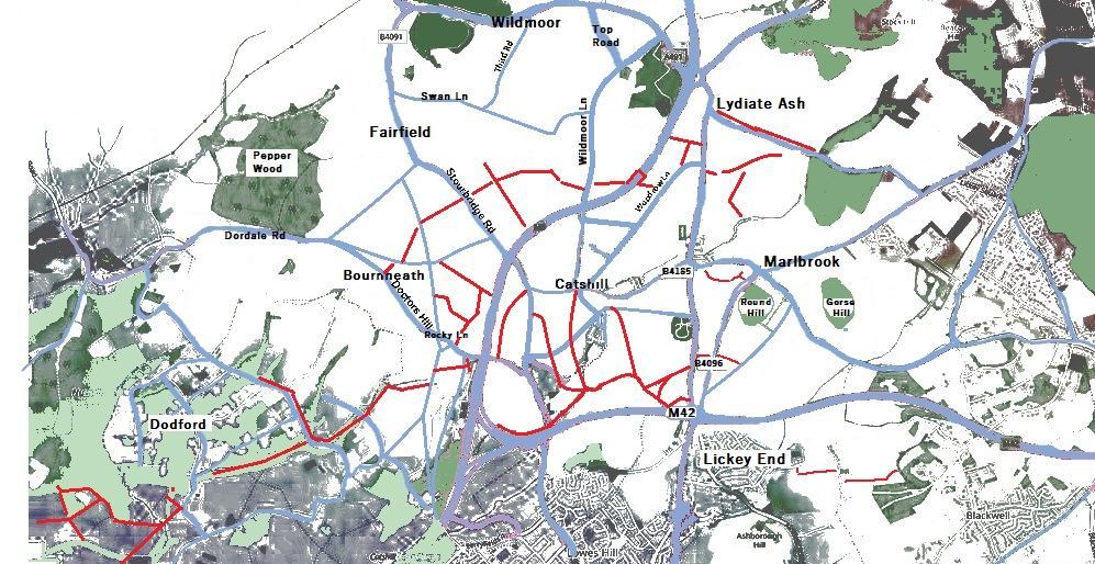 A map-like image of North Bromsgrove with approximate locations of public footpaths marked in red