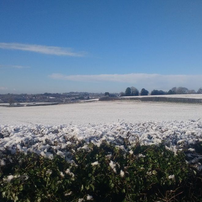 Snow scene over farm